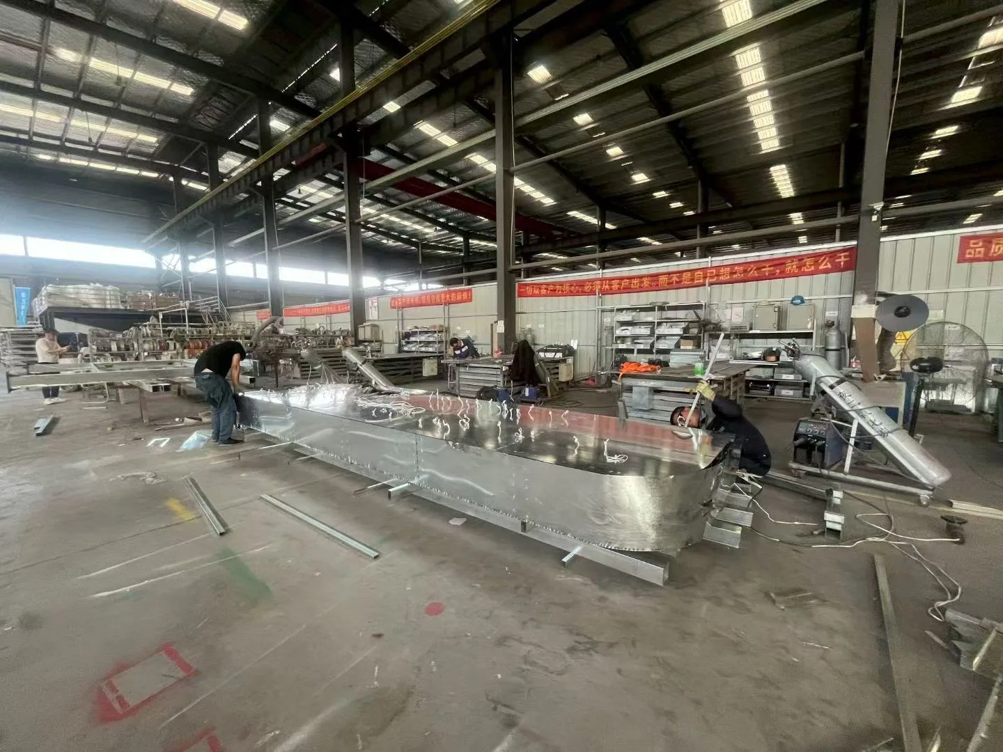 Large fabricated metal sign under assembly at a RUIGONGSIGN production facility