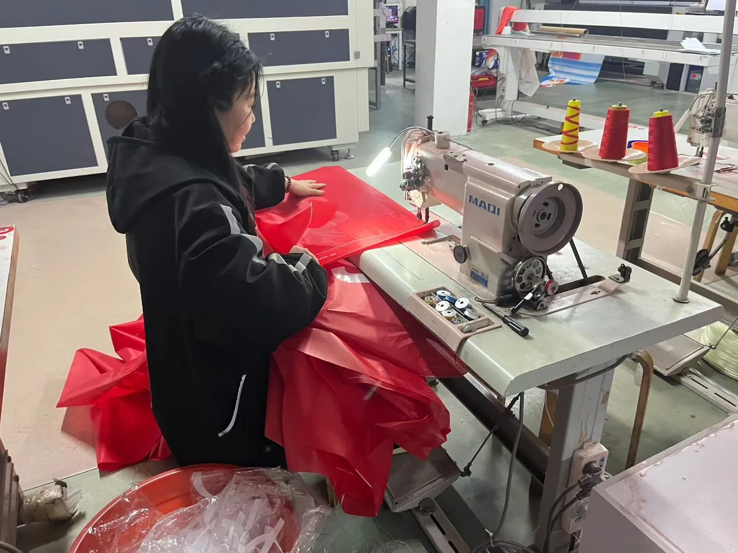 Flexible sign face sewing and finishing at a RUIGONGSIGN production facility