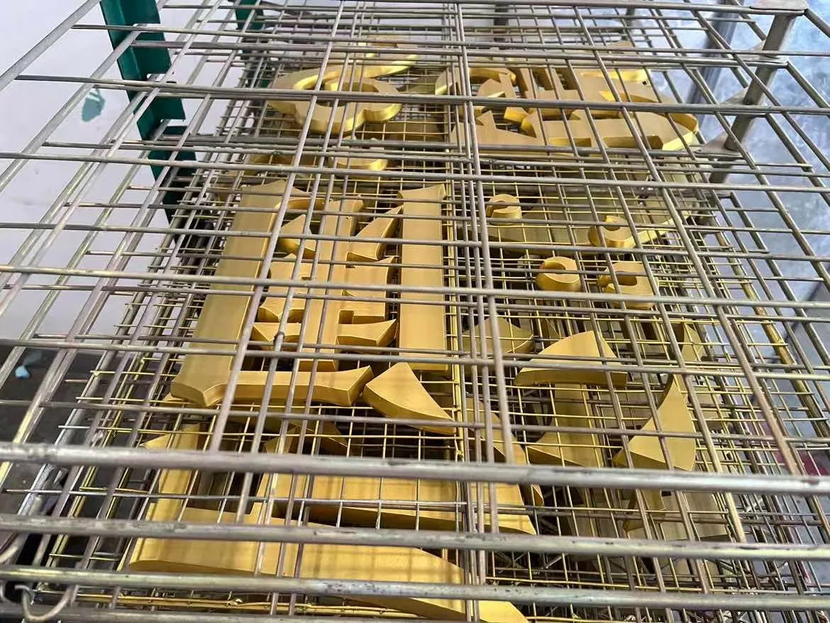 Batch of gold-finished metal letter components