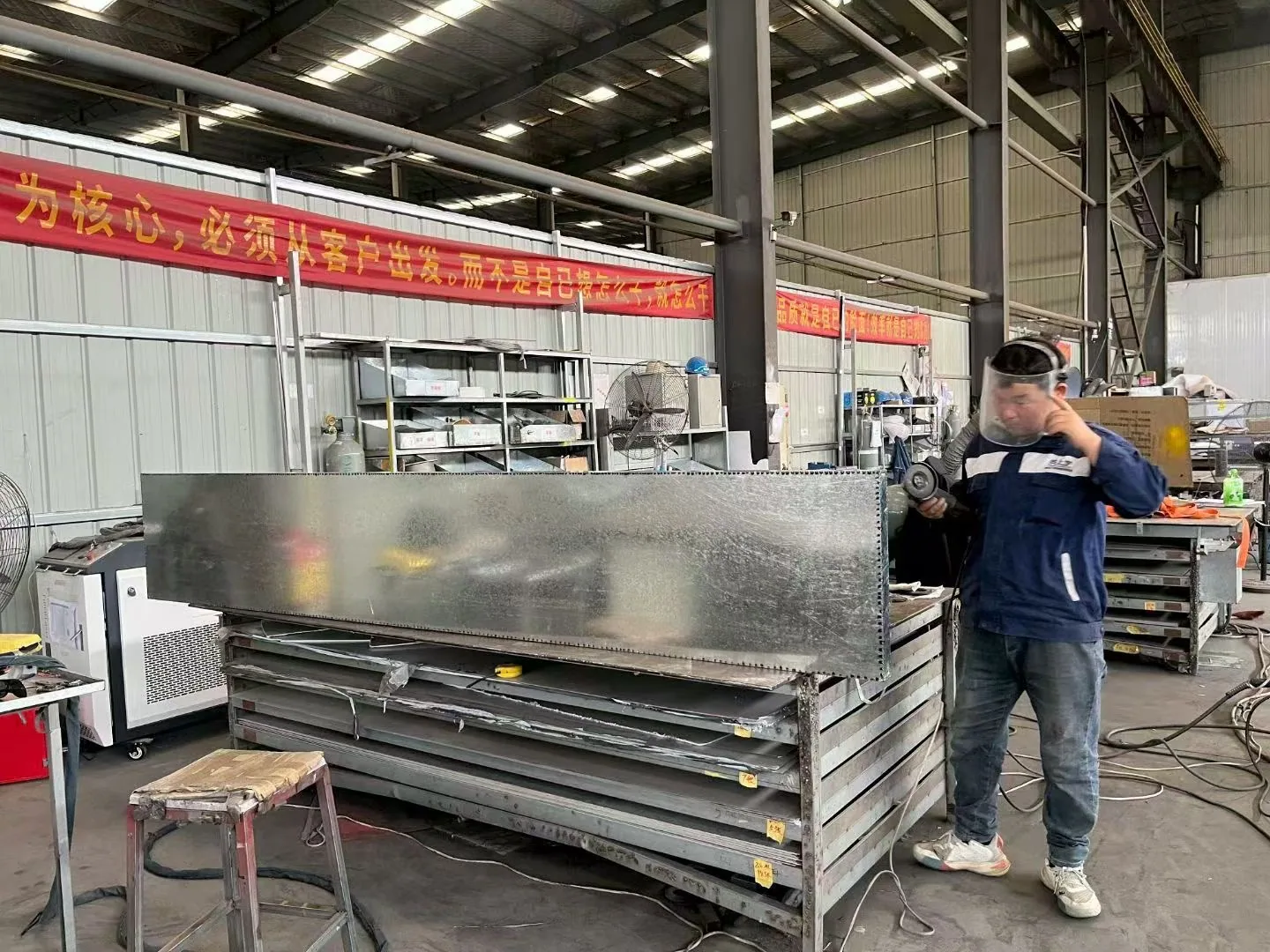 Surface preparation on a fabricated metal sign component